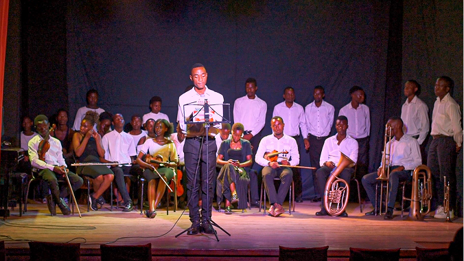 A group of smiling children participating in an art class.